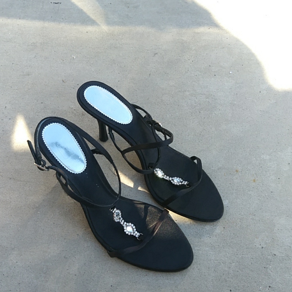 Pair of black heals with diamond.